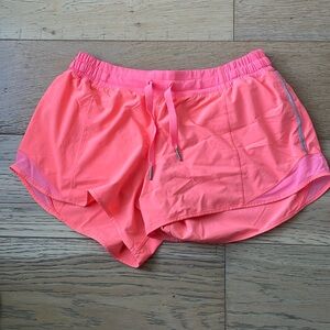 Lululemon Hotty Hot shorts 2.5 inseam size 10 bright coral/pink color